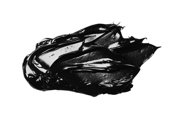 Smear of black glossy paint on white background, top view - Valokuva, kuva