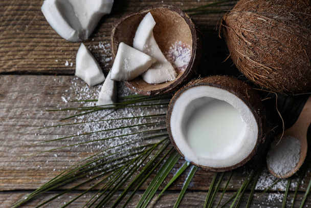 Flat lay composition with coconut milk on wooden table, space for text - Foto, Imagen