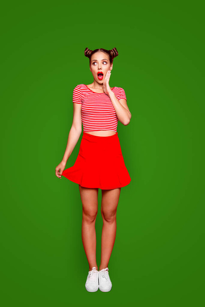 Full-length body vertical portrait of crazy lovely joyful girl with open red mouth, shocked by great news isolated on red background. - Foto, afbeelding