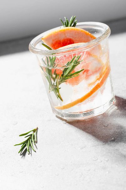 Grapefruit Rosemary Drink on Bright Background, Refreshing Drink, Cocktail - 写真・画像