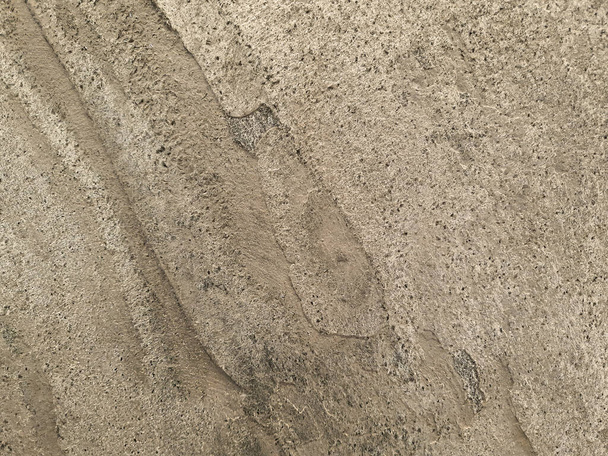 Textuur van steen lichtgeel. Achtergrond met zand kleur stenen oppervlak. Sjabloon voor achtergrond, webpagina, tegel, verpakking, fotofoon. - Foto, afbeelding