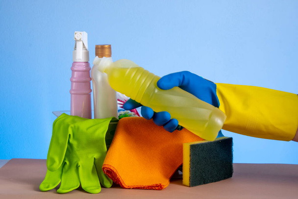 basket with cleaning products for home hygiene use with plastic packaging - 写真・画像