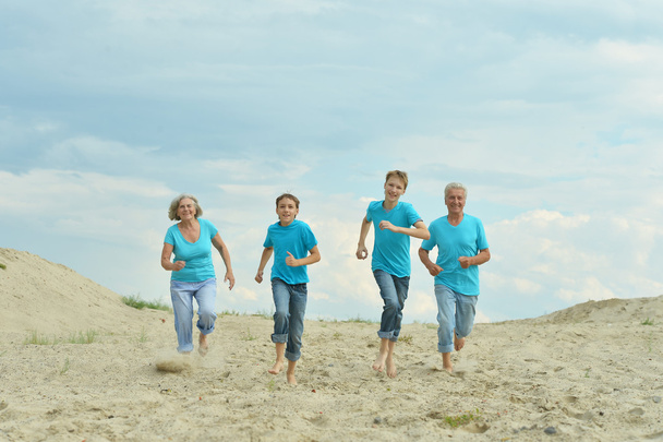 Family a running in the summer - Foto, imagen