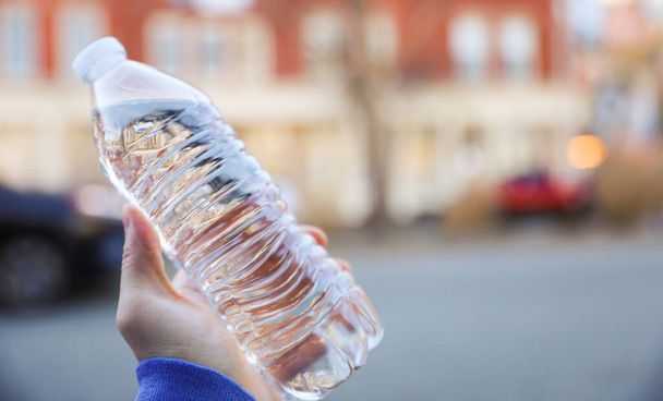 plastic water bottle is a portable container made of plastic used to store drinking water showing convenience and accessibility of clean water and negative impact of plastic waste on the environment - 写真・画像