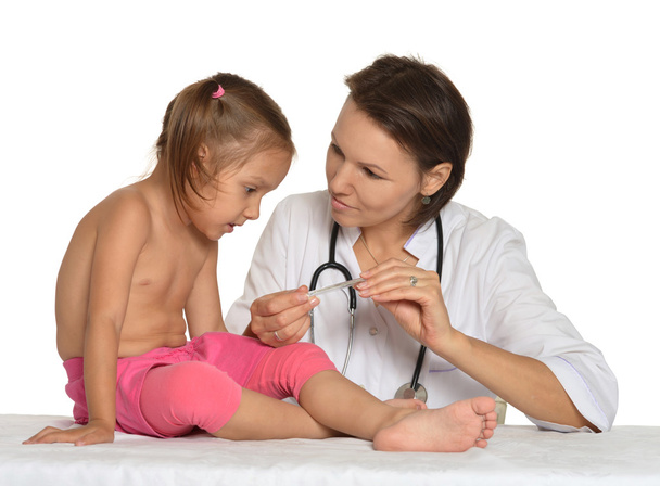 Female doctor with little girl - Фото, изображение