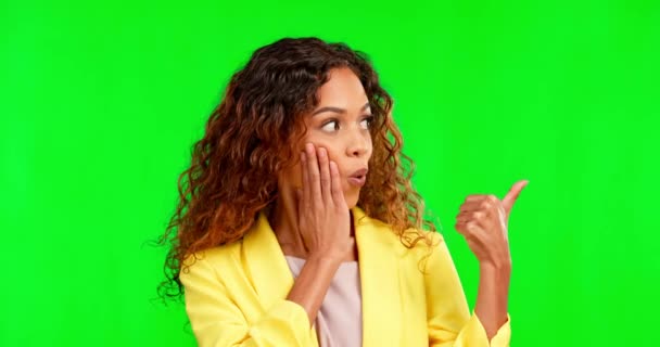 Shock, green screen and woman in a studio pointing at mockup space for advertising or marketing. Surprise, amazed and portrait of model showing mock up for product placement by chroma key background - Footage, Video