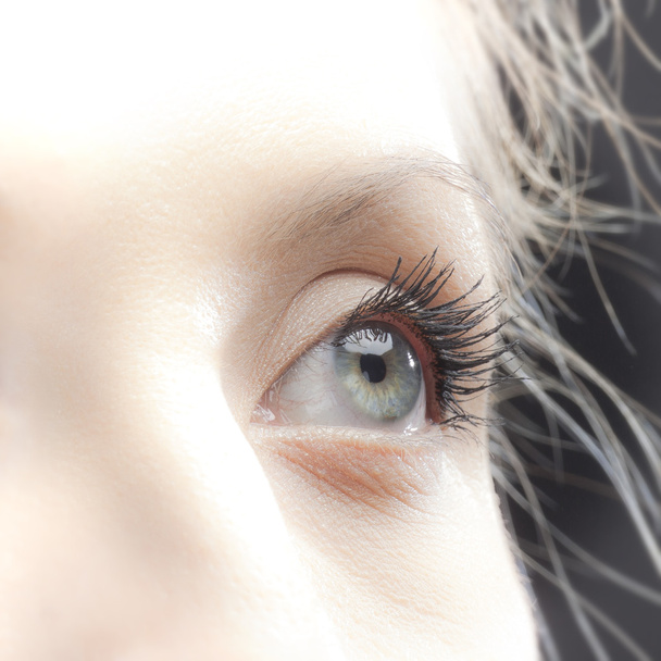 Fiatal nő kék szem. Színes kép - Fotó, kép