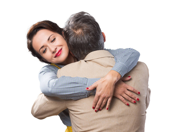 Happy vintage couple 1950s style smiling and hugging - Фото, изображение