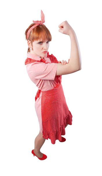 Confident strong vintage style housewife showing biceps and fist: women empowerment and feminism concept - Φωτογραφία, εικόνα