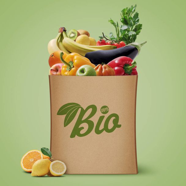 Fresh organic vegetables in a grocery bag, healthy eating and grocery shopping concept - Fotó, kép