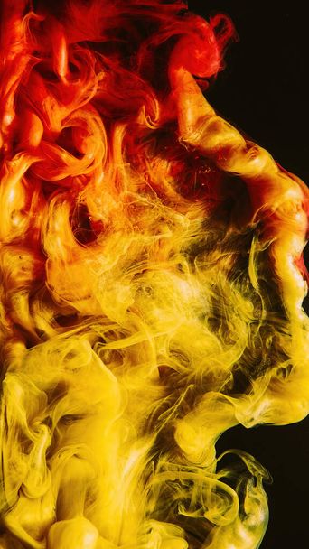 Paint splash. Ink water. Fluid mix. Hot burst. Bright red yellow orange color gradient vapor cloud on dark black abstract background. - Foto, imagen