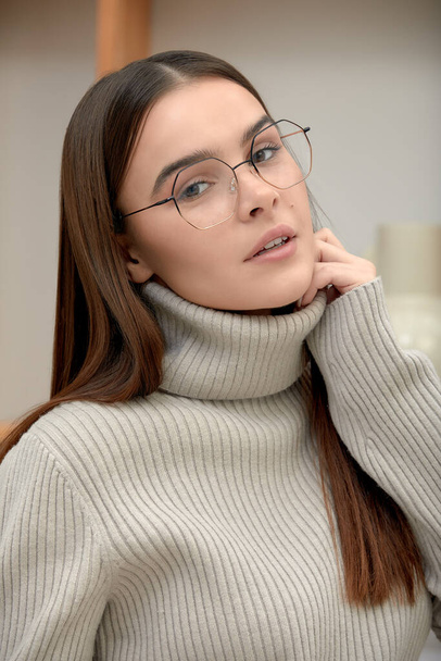 Modern girl with glasses, brunette in glasses posing at the camera, fashion, confident woman in glasses businesswoman. - Photo, Image