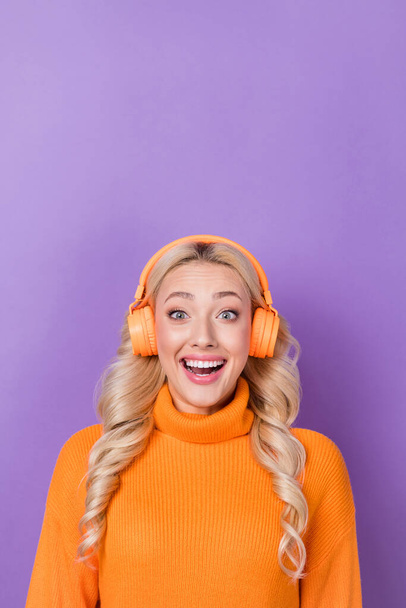 Vertical photo of astonished positive girl toothy smile enjoy bass sound headphones isolated on purple color background. - Valokuva, kuva