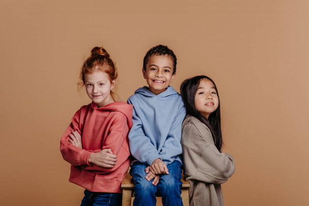 Portrait of three children, studio shoot. Concept of diversity in a friendship. - Zdjęcie, obraz