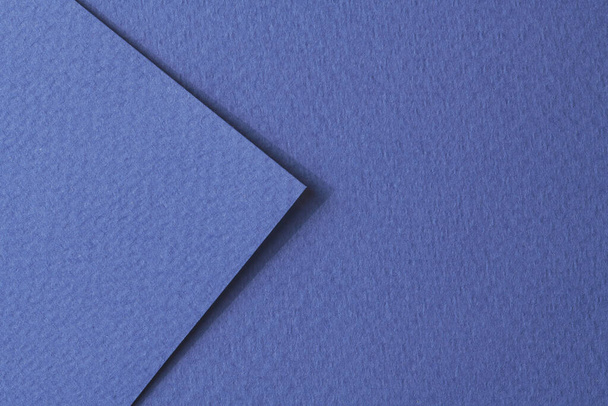 Rough kraft paper pieces background, geometric monochrome paper texture blue color. Mockup with copy space for text - Photo, image