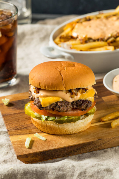 Fast Food Animal Cheeseburger with Burger Sauce and Pickles - Foto, imagen
