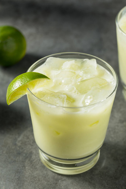 Homemade Sweet Refreshing Brazilian Lemonade with LImes and Sugar - 写真・画像