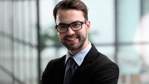 Happy young business man working in modern office - Foto, Bild