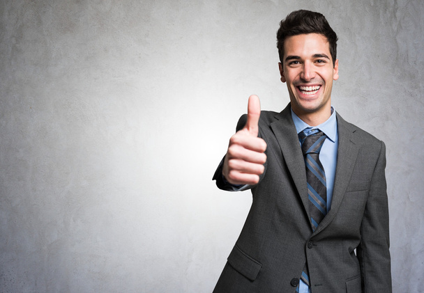 Businessman giving thumbs up - Photo, Image