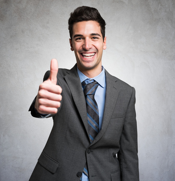Businessman giving thumbs up - Photo, image