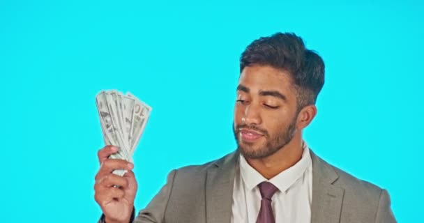 Business man with money fan isolated on studio background for wealth, cash winning or financial freedom with smile. Rich and confident Indian person or winner investment in bonus, cashback or lottery. - Footage, Video