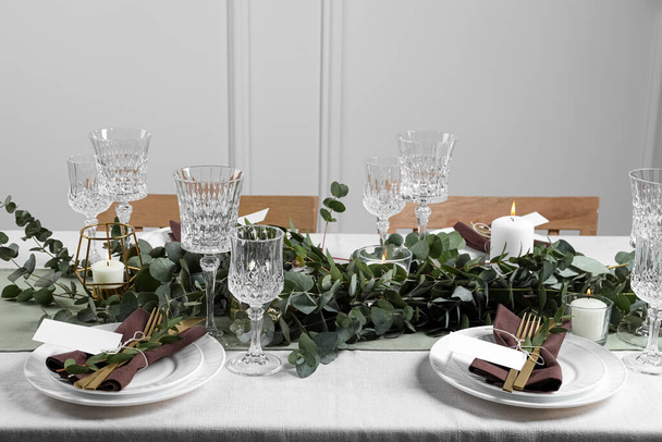 Luxury table setting with beautiful decor and blank cards indoors. Festive dinner - Фото, зображення