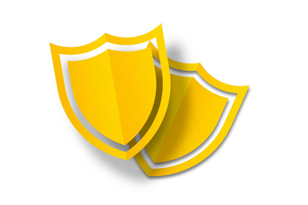 escudo de papel amarillo Corte de papel perforado en forma de escudo aislado sobre fondo blanco. - Foto, Imagen