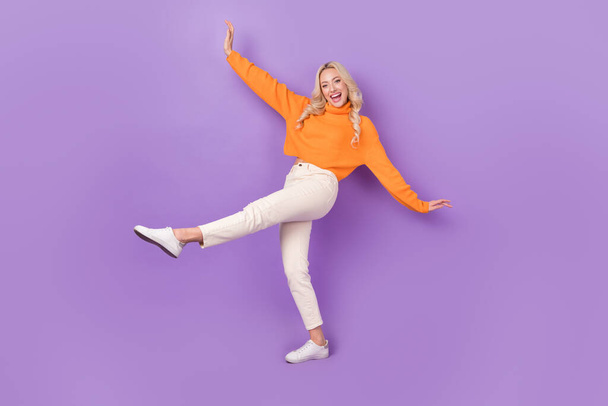 Full body portrait of positive nice lady enjoy dancing chilling isolated on purple color background. - Foto, imagen