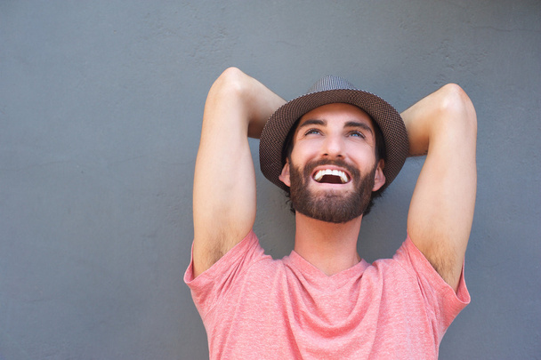 Happy carefree man laughing with hat - Photo, image