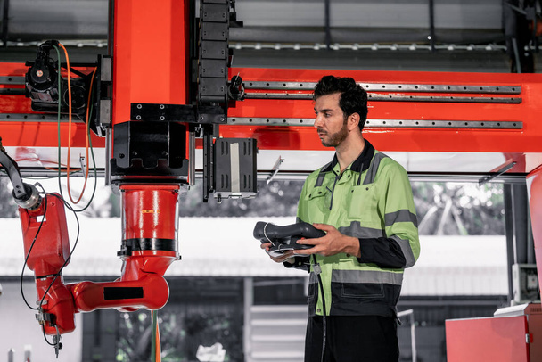 Experienced robotic technicians automate, set up, and access to a welding, lifting process via a control panel display. The production lines are repeatable, reliable, consistent, and self-checking. - Foto, afbeelding