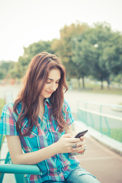 beautiful young hipster woman using smartphone - Photo, Image