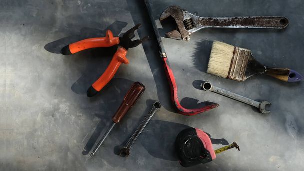 Set of assorted work tools. Various carpentry tools on wooden background. - Photo, Image