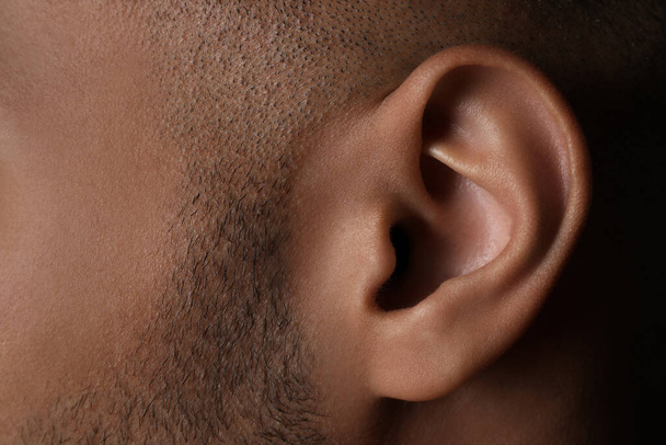Closeup view of man, focus on ear - Foto, Bild