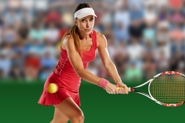 Portrait of beautiful female tennis player doing serve during the match - Fotó, kép