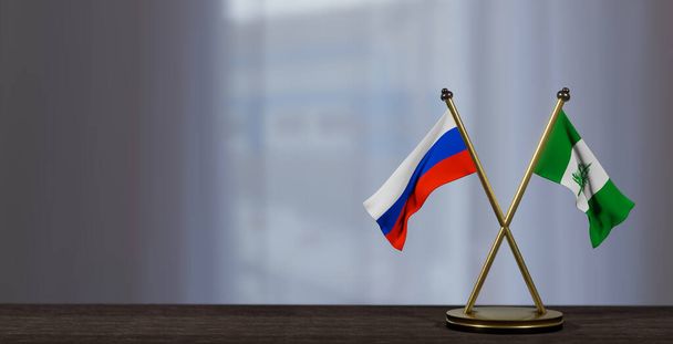 Russia and Norfolk Island flags on table. Negotiation between Norfolk Island and Russia. on little blur background. 3D work and 3D image - Photo, Image