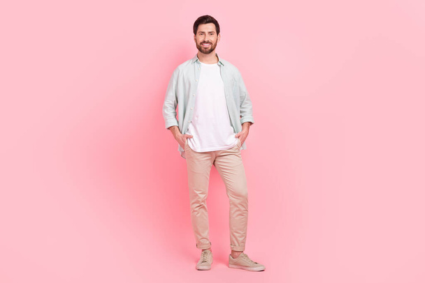 Full length photo of nice young male hands pockets shopping banner model wear trendy blue garment isolated on pink color background. - Valokuva, kuva