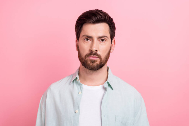 Photo portrait of attractive young man serious face indifferent calm dressed stylish blue clothes isolated on pink color background. - Fotografie, Obrázek