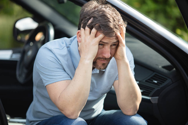 a depressed man is sad in a car - Photo, Image