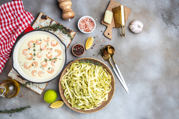 shrimps bechamel sauce in pan. pasta. Food recipe background. Close up. - Photo, image