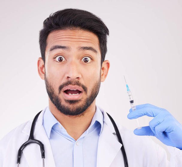 Wow, portrait and doctor with vaccine, syringe and surprise in studio for healthcare innovation on white background. Omg, face and shocked guy health expert with needle for treatment or immunization. - Photo, Image
