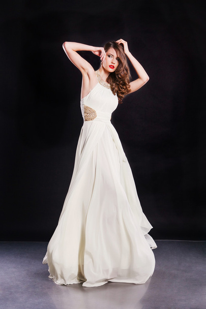 Beautiful attractive supermodel wearing gorgeous white dress - 写真・画像