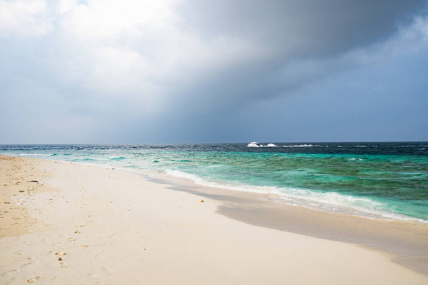 beautiful exotic tropical beach and stormy clouds - Фото, изображение
