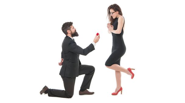 Pure feelings. Will you marry me. i said yes. happy valentines day. tuxedo couple formal event. couple in love celebrate engagement. wedding party time. man on one knee making marriage proposal. - Photo, image