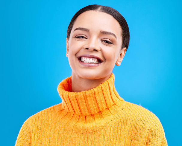 Happy, face and portrait of woman in studio for relax, beauty and natural makeup. Cosmetics, fashion and happiness with Latino female isolated on blue background for glow, cool and satisfaction. - Foto, Imagem