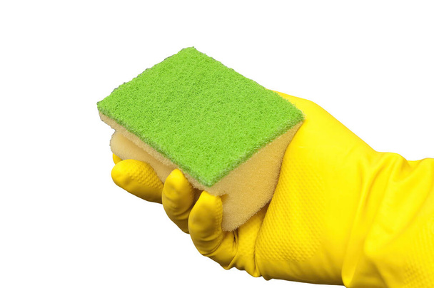 an abrasive sponge held in a hand in a yellow glove on a transparent background - Фото, изображение