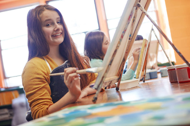 Im going to be an artist when I grow up. Portrait of a young schoolgirl in an art class - Foto, Bild