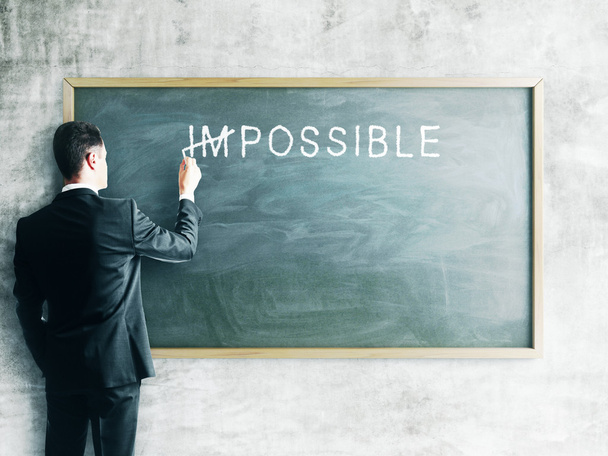 Businessman drawing impossible - Foto, imagen