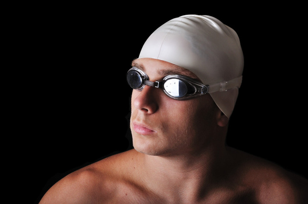 Male swimmer isolated in black - Foto, Bild