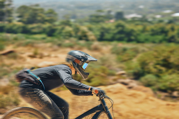 Mountain bike, man and race for speed, dirt or nature in summer for mock up, extreme sport or motion blur. Bicycle, cycling male and challenge for fast workout, training or fitness mockup in sunshine. - Photo, Image