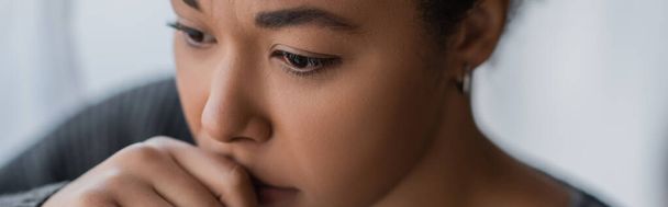 Frustrated multiracial woman with psychological problem looking away at home, banner  - Фото, зображення